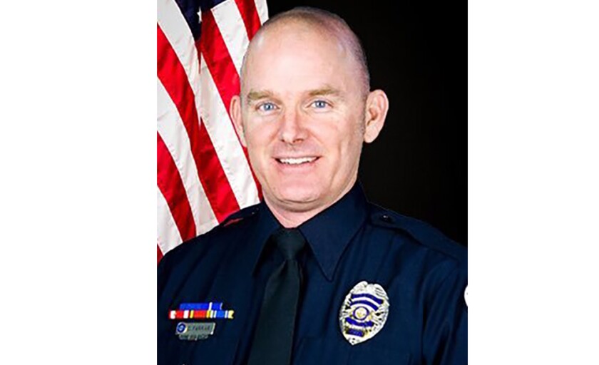This photo provided by Chandler Police Department shows Officer Christopher Farrar. A suspect in a stolen car hit two officers, killing Farrar and critically injuring the other, during a wild chase in Arizona, involving gunfire and multiple law enforcement agencies, authorities said Thursday, April 30, 2021. (Chandler Police Department via AP)