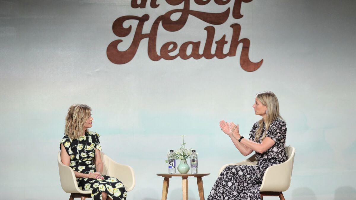 Meg Ryan, left, and Gwyneth Paltrow speak onstage at the In Goop Health summit.