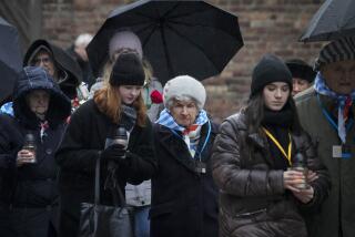 Holocaust survivors and relatives arrive at the Auschwitz Nazi death camp in Oswiecim, Poland, Saturday, Jan. 27, 2024. Survivors of Nazi death camps marked the 79th anniversary of the liberation of the Auschwitz-Birkenau camp during World War II in a modest ceremony in southern Poland.(AP Photo/Czarek Sokolowski)