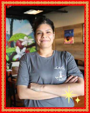 Diana Martinez smiles inside her coffee shop Cafe Calle, on South Central Avenue