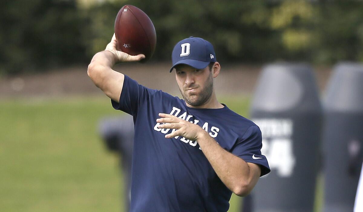 Dallas Cowboys quarterback Tony Romo throws during football practice at the team's practice facility Wednesday.