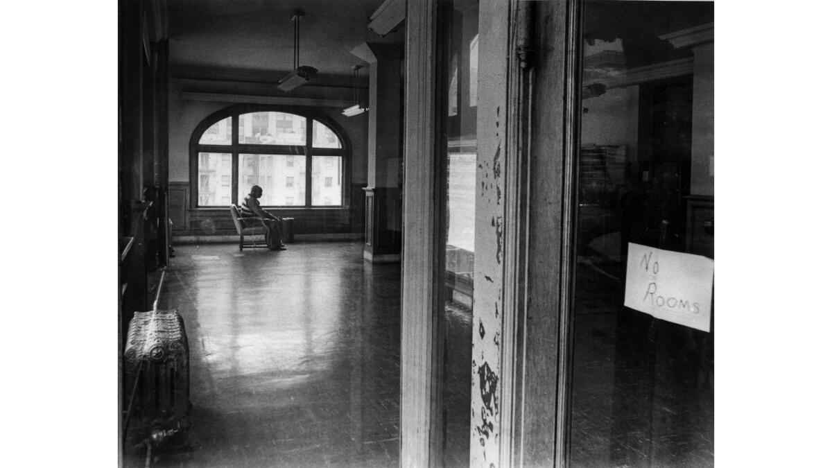 May 16, 1969: Henry Scott, 64, plant engineer at the Northern Hotel, sits in the lobby of the Bunker Hill building awaiting the eviction of Bunnie Burns, the last resident who refused to leave.
