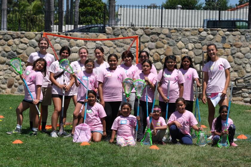 Girls gathered at Stonefield Park in San Juan Capistrano last summer for a free lacrosse camps with Leaders4LAX.