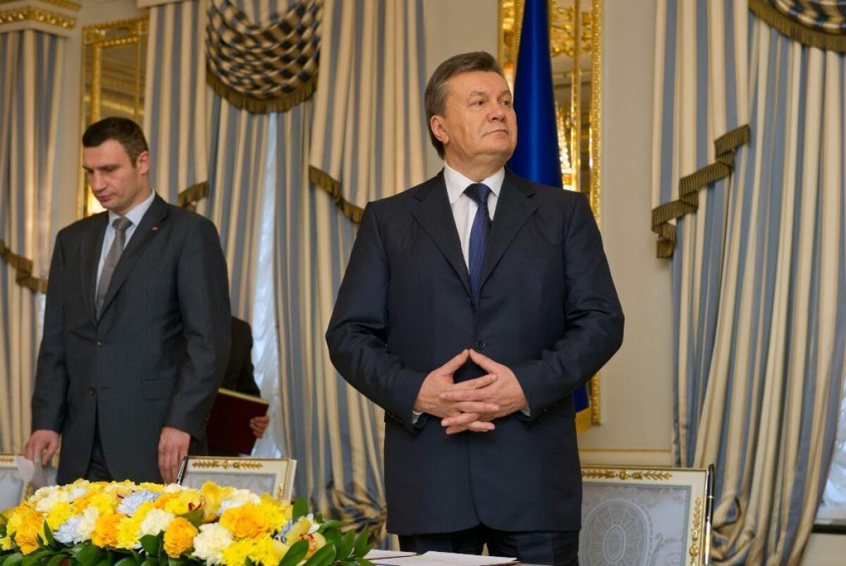 Under the presidency of ousted Ukrainian leader Viktor Yanukovich -- seen above last month with opposition leader Vitali Klitschko -- billions of dollars were siphoned out of the country, leaving Ukraine perilously close to bankruptcy.
