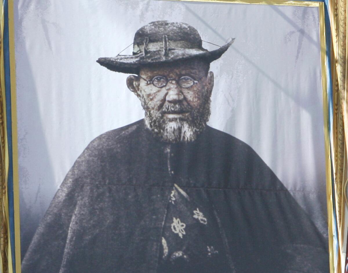 A tapestry at St. Peter's Basilica depicts Father Damien, born as Jozef De Veuster, who did missionary work among leprosy patients in Hawaii.