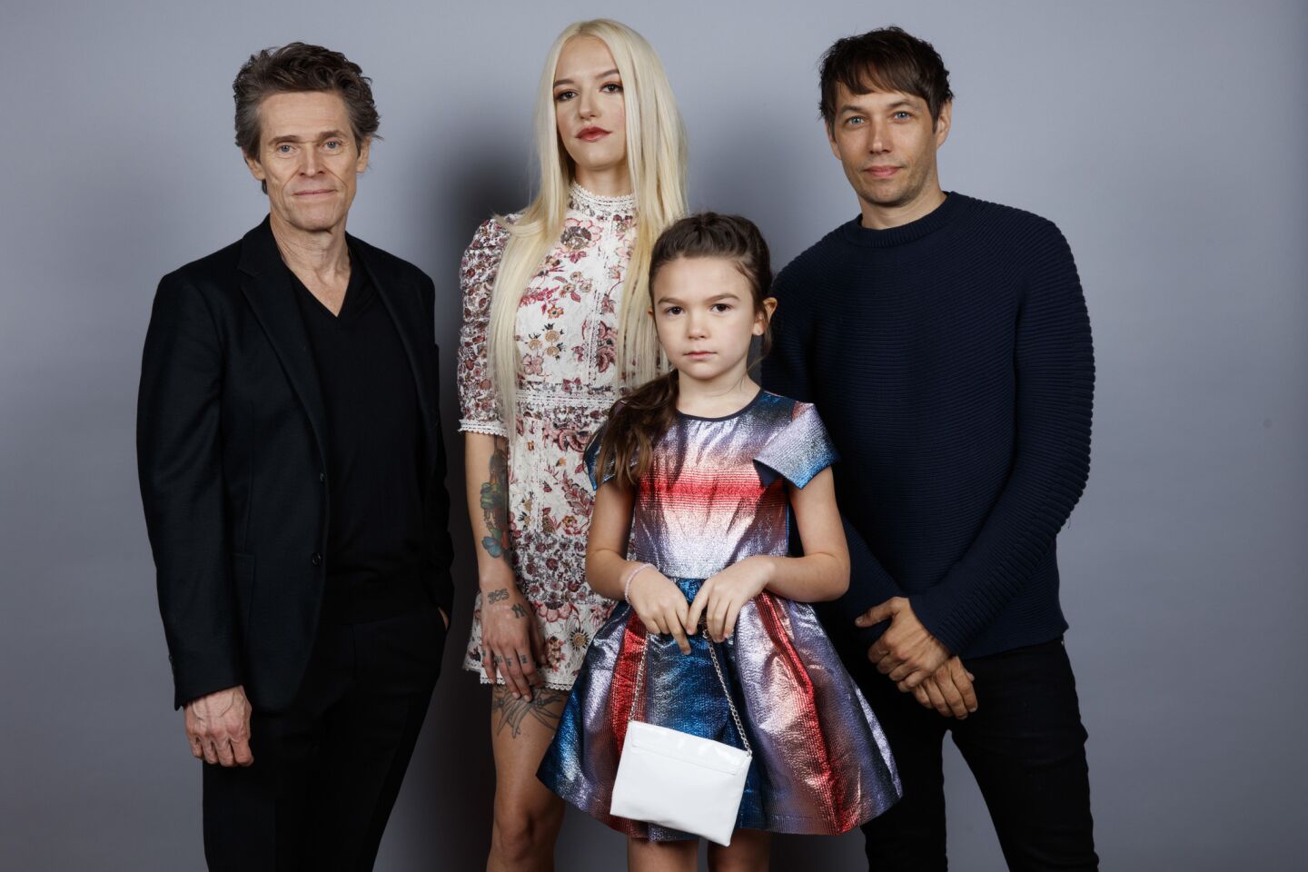 Willem Dafoe, left, Bria Binaite, Brooklynn Prince, and director Sean Baker from the film "The Florida Project."