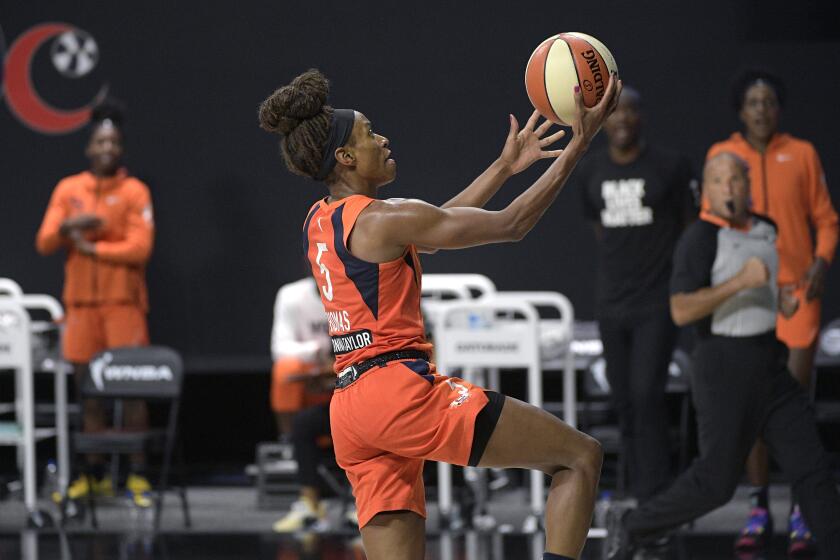 Connecticut Sun guard Jasmine Thomas (5) goes up for a breakaway basket during the second half of Game 1 of a WNBA basketball semifinal round playoff game against the Las Vegas Aces, Sunday, Sept. 20, 2020, in Bradenton, Fla. (AP Photo/Phelan M. Ebenhack)