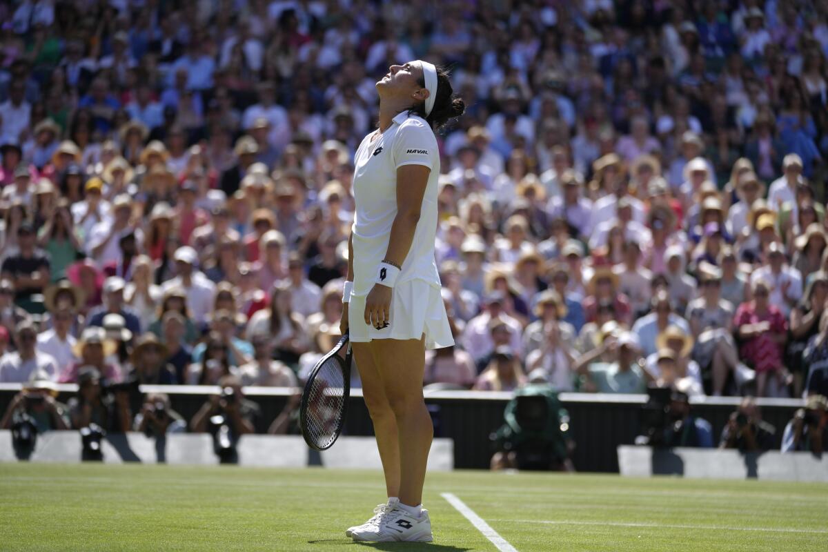 Tunisia's Ons Jabeur reacts after losing a point to Kazakhstan's Elena Rybakina in the final of the women's singles on day thirteen of the Wimbledon tennis championships in London, Saturday, July 9, 2022. (AP Photo/Kirsty Wigglesworth)