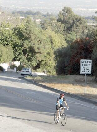 A bicyclist heads up North Euclid Avenue in San Antonio Heights. The unincorporated foothill community in San Bernardino County is part suburban, part rural.