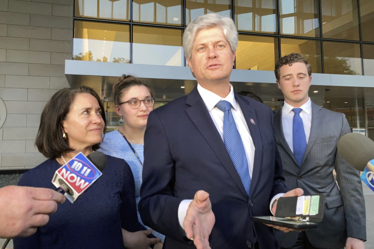U.S. Rep. Jeff Fortenberry, R-Neb., center, speaks with the media outside the federal courthouse in Los Angeles, Thursday, March 24, 2022. Fortenberry was convicted Thursday of charges that he lied to federal authorities about an illegal $30,000 contribution to his campaign from a foreign billionaire at a 2016 Los Angeles fundraiser. (AP Photo/Brian Melley)