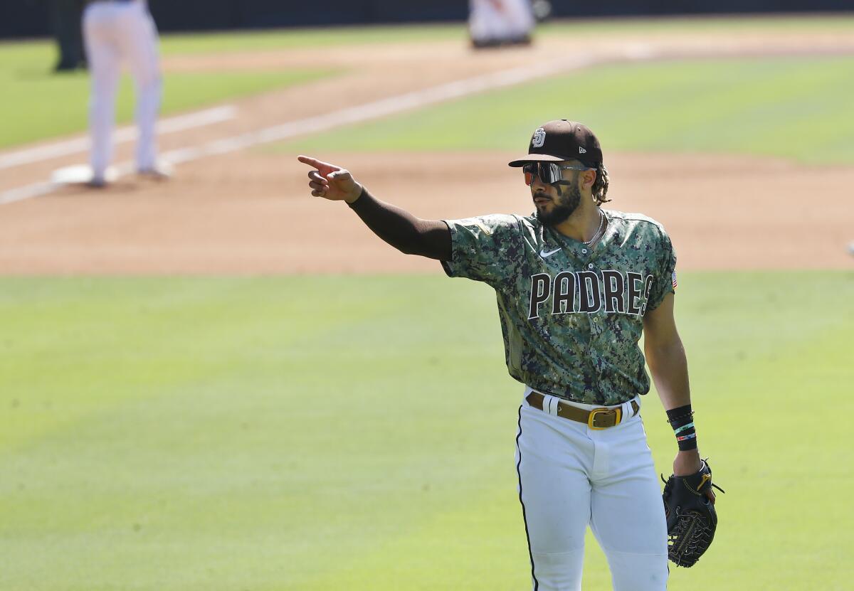 Fernando Tatis Jr. points to fans from right field during Sunday's game against the Houston Astros.