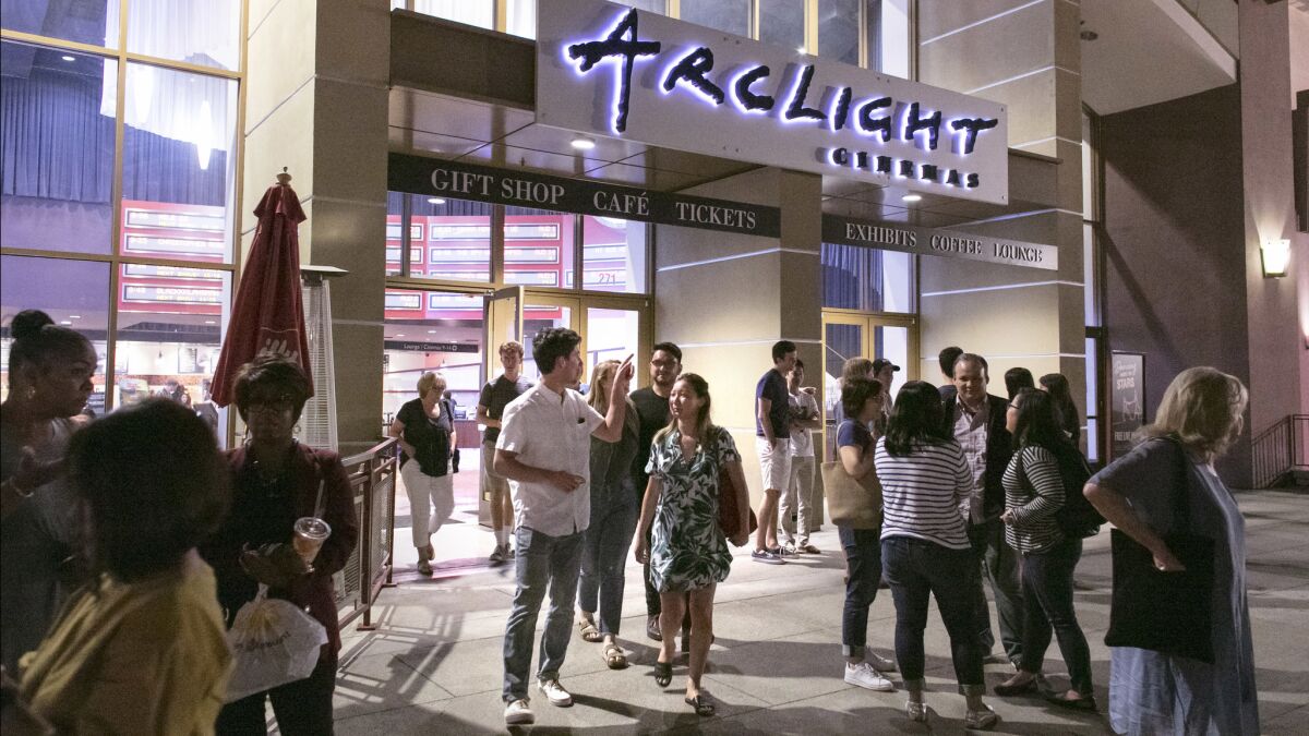 People stream out of ArcLight Cinemas in Pasadena, where "Crazy Rich Asians" was screening.
