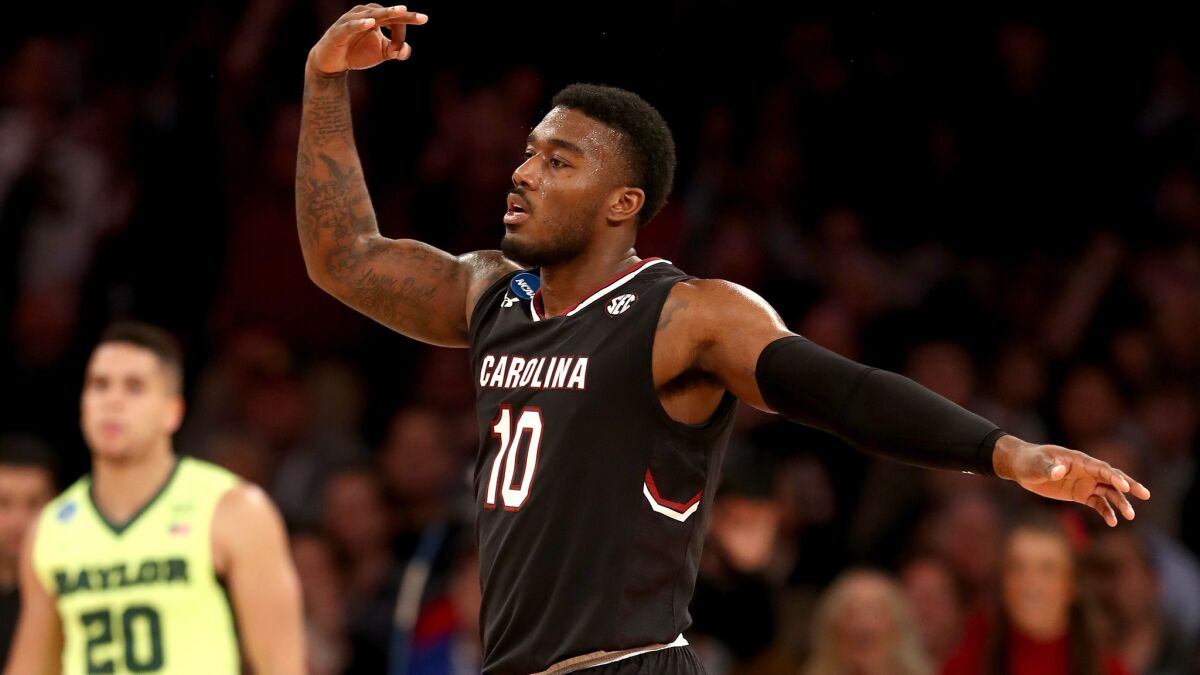 South Carolina guard Duane Notice celebrates after making a three-pointer against Baylor during the second half Friday night.