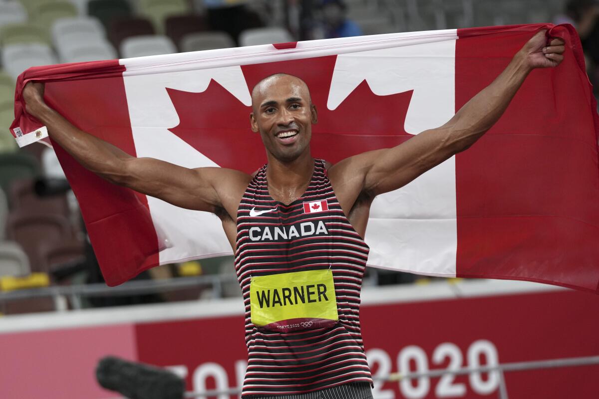 Canada's Damian Warner celebrates his Olympic victory in the decathlon Friday.