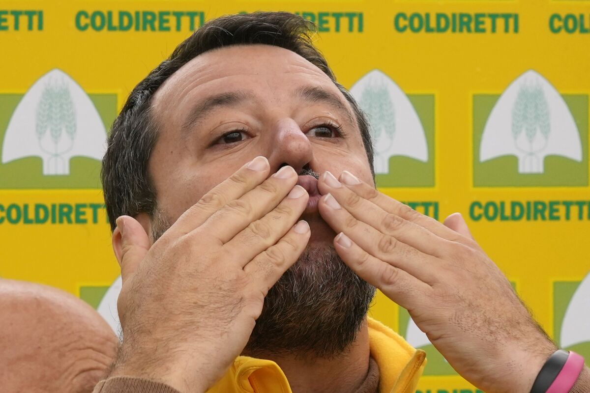 Leader of the League party Matteo Salvini blows a kiss as he joins an Italian farmers association's protest on high energy costs affecting production in the farming industry, in Milan, Italy, Friday, Sept. 30, 2022. (AP Photo/Antonio Calanni)
