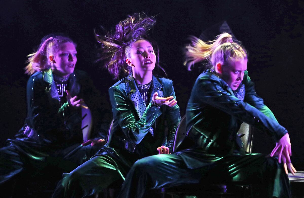 Dance team captain Bella Salerno, center, rehearses a performance from the Newport Harbor High show "ArreiS" on Tuesday.