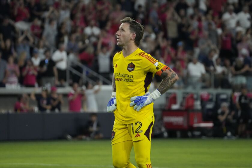 Houston Dynamo goalkeeper Steve Clark pauses after giving up a goal to St. Louis City's Nicholas Gioacchini on a penalty kick during the second half of an MLS soccer match Saturday, June 3, 2023, in St. Louis. (AP Photo/Jeff Roberson)