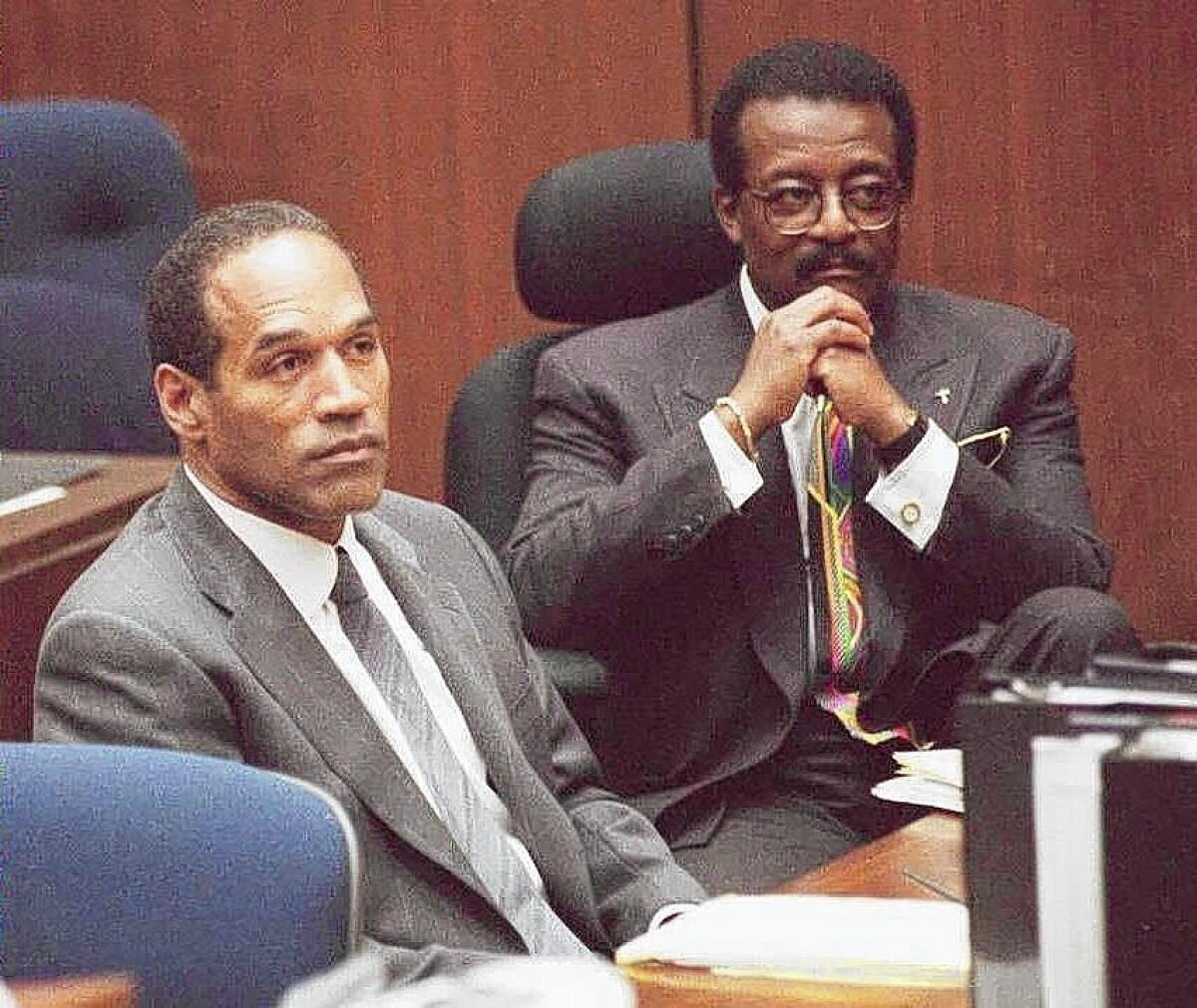 O.J. Simpson, left, and his attorney Johnnie Cochran Jr. during the trial.