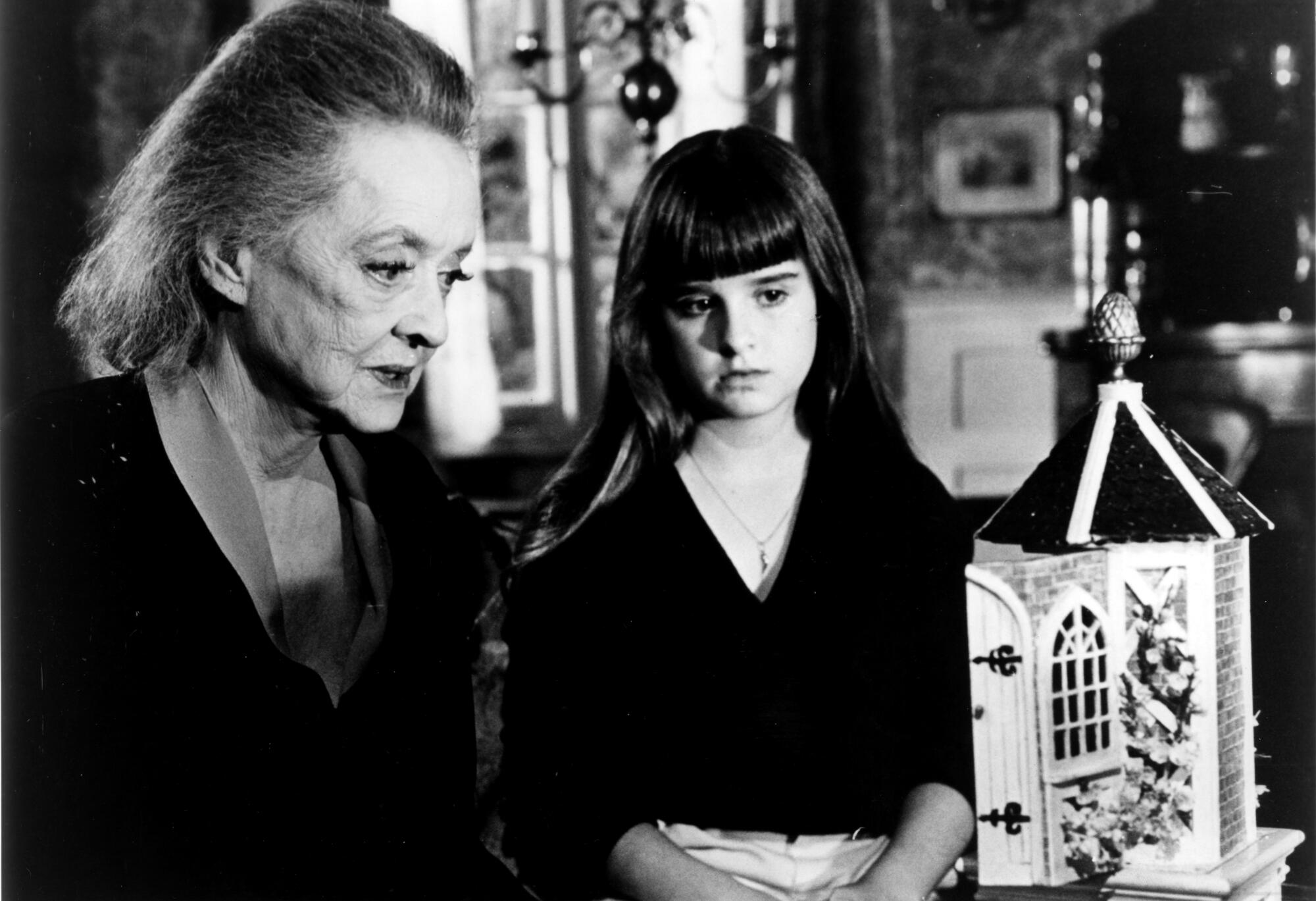 Bette Davis, left, with Kyle Richards in the 1980 film "The Watcher in the Woods."