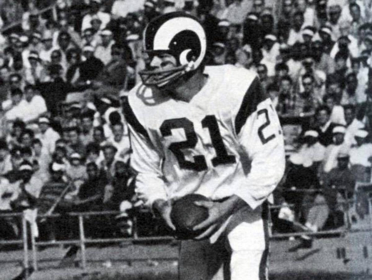 Rams safety Eddie Meador runs with the ball during a game in the 1960s.