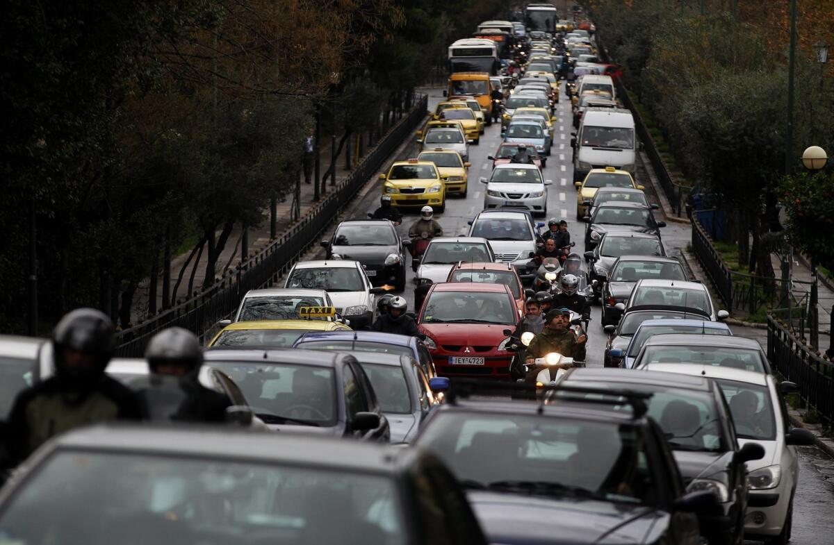 Cars jam a main road into central Athens as a strike by subway workers stretched into its eighth consecutive day.