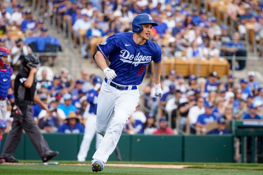 The Dodgers' Corey Seager runs to first base during a game against the Chicago Cubs at Camelback Ranch on Feb. 23, 2020.