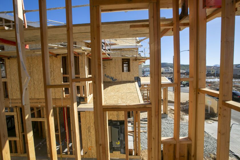 A view through the framework of a new single family home under construction out to the Seville neighborhood in Chula Vista on Friday, January 31, 2020.