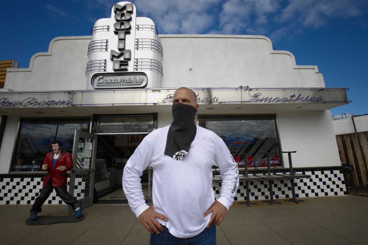 David Spatafore, principal at Blue Ridge Hospitality stands in front of Moo Time Cookies & Creamery in Coronado on Friday April 17, 2020. Moo Time Cookies & Creamery is among his 13 different eatery and restaurants he owns. Since the Coronavirus pandemic, Spatafore was forced to close nine of his restaurants and lay off 270 of his employees.