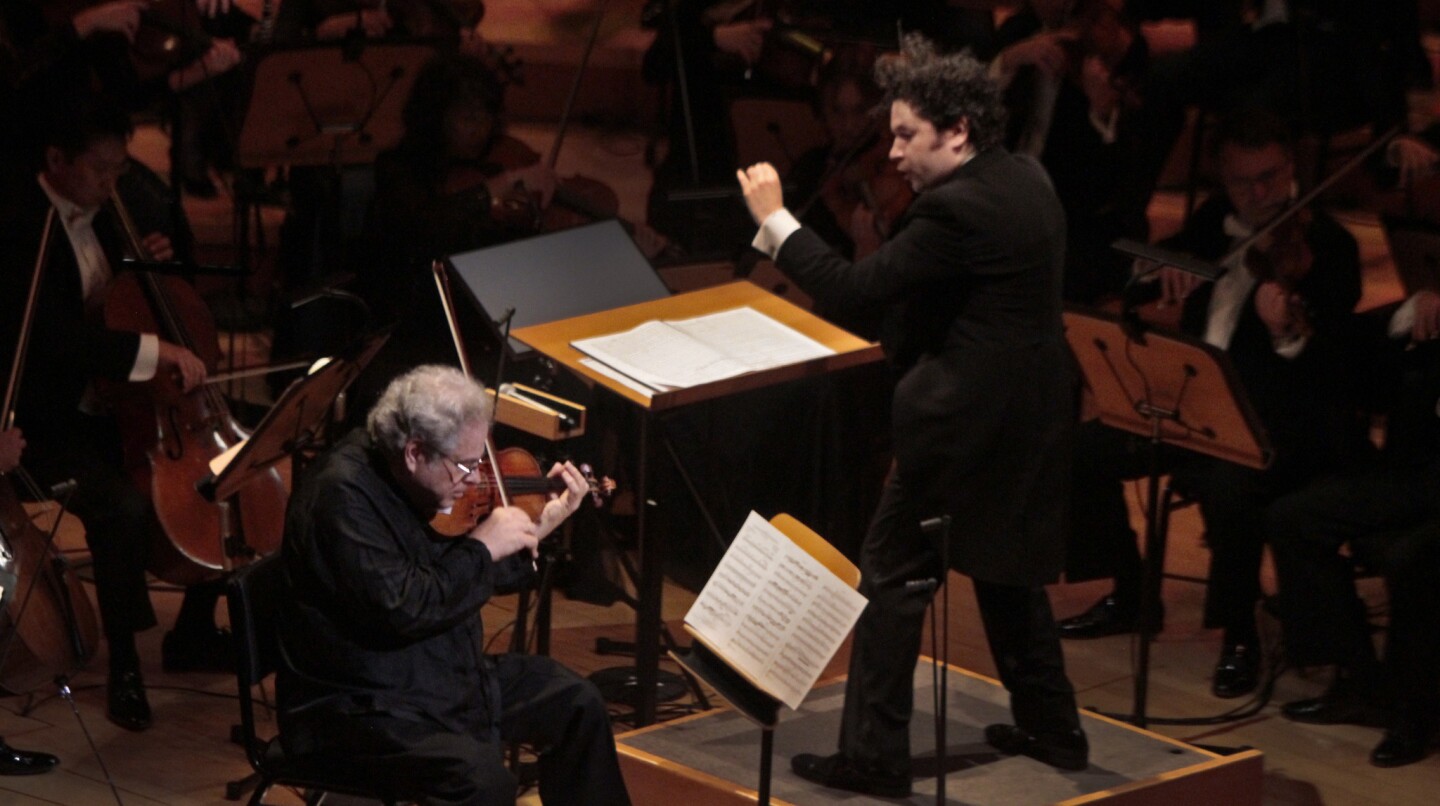 Violinist Itzhak Perlman performs with Gustavo Dudamel conducting the Los Angeles Philharmonic during it's season-opening gala concert at Walt Disney Concert Hall on Sept. 30, 2014.
