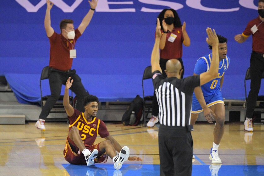 USC guard Tahj Eaddy reacts after making a game-winning three-point shot.