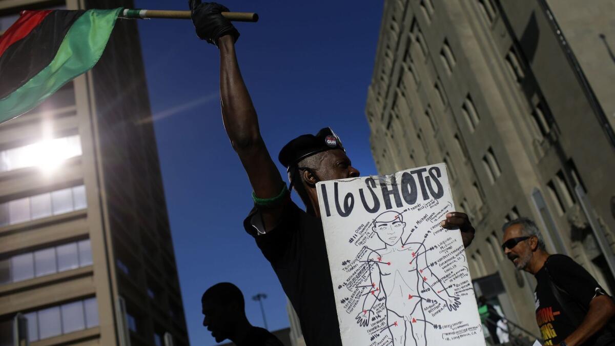 In September, demonstrators protested in Chicago as jury selection began in the murder trial of Chicago police Officer Jason Van Dyke.
