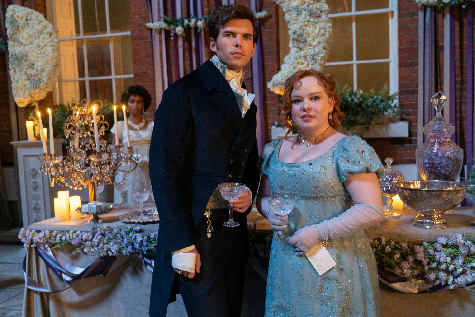 A man and woman in costume as the stars of Netflix's Regency period drama "Bridgerton." 