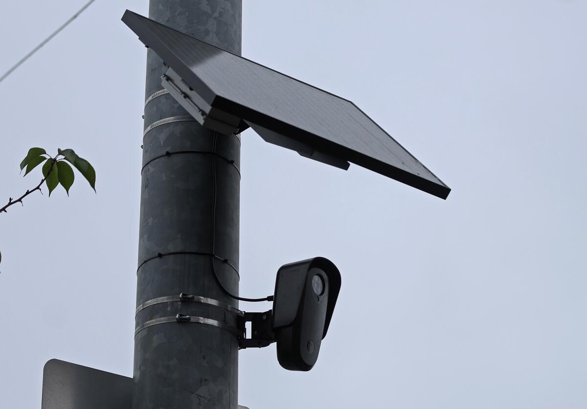 An automated license plate reader is mounted on a pole.