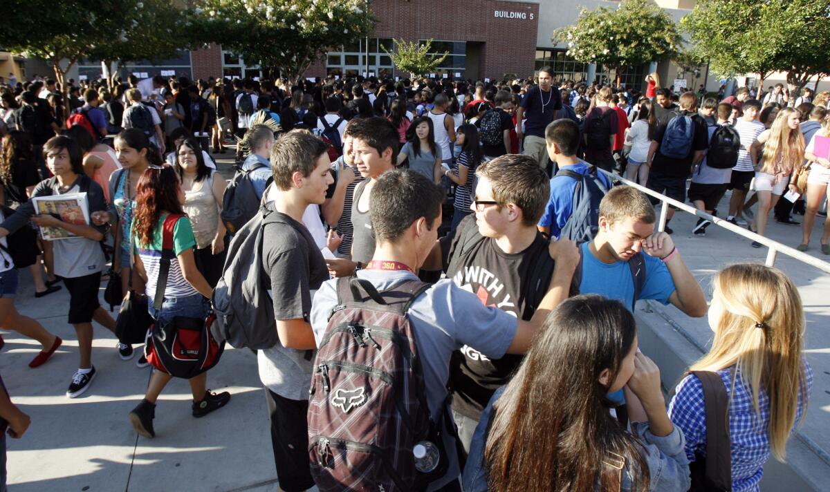 Burroughs High School students greet each other on the first day of school in this 2012 file photo.