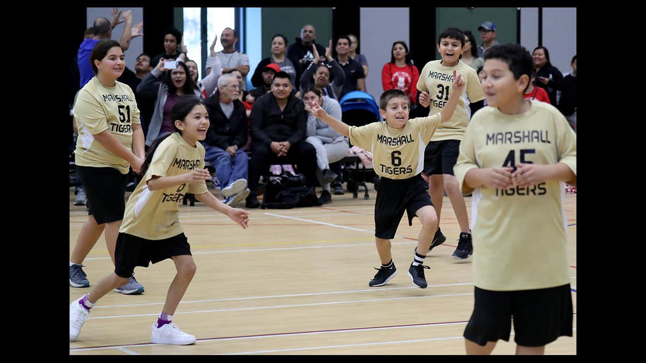The Marshall A team cheer as they win the City of Glendale Community & Parks One Glendale After School Youth Sports Program Volleyball Championship game, at Pacific Park in Glendale on Saturday, Jan. 19, 2019.