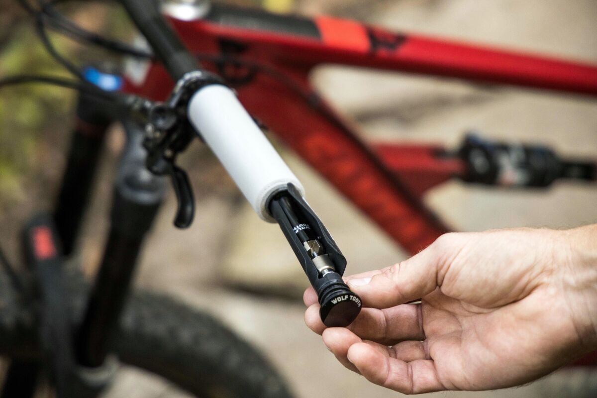 Wolf Tooth Components EnCase System puts essential multitools and other small items inside your bike’s handlebar.