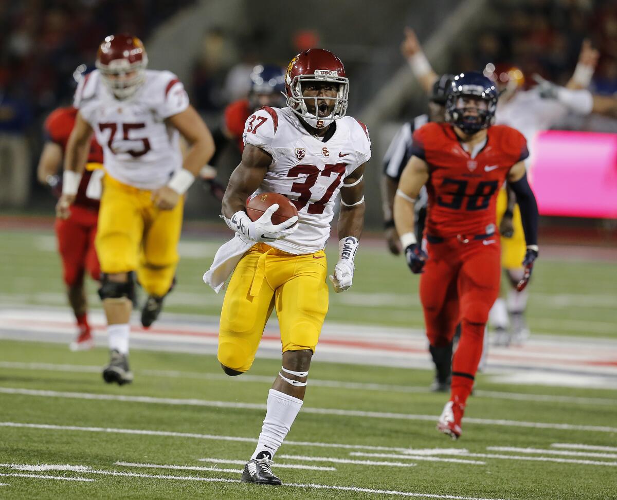 USC running back Javorius Allen pulls away from the Arizona defense and runs a touchdown in 2014