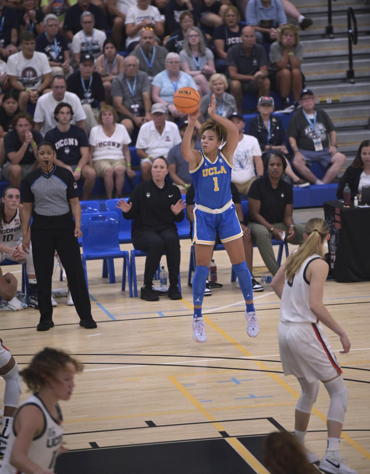 UCLA's Kiki Rice shoots against Connecticut during the Cayman Islands Classic in George Town, Cayman Islands