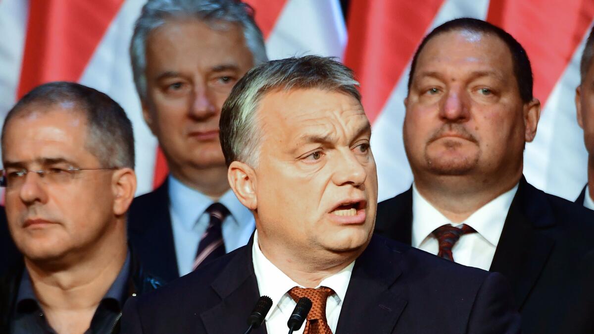 Hungarian Prime Minister Viktor Orban, center, gives a speech in Budapest on Oct. 2, 2016.