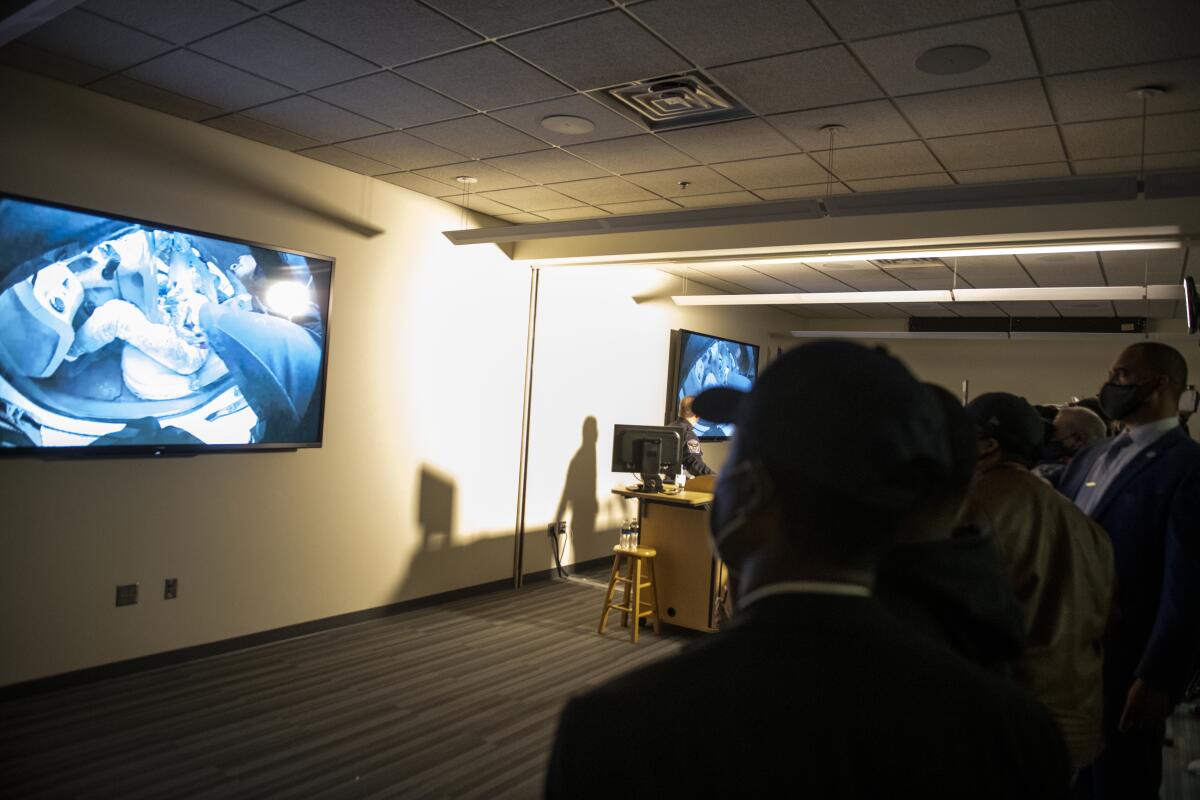 People watch as the body camera footage of the killing of 20-year-old Daunte Wright