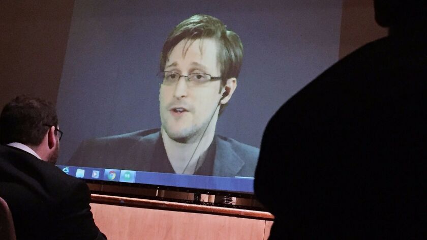 Former National Security Agency contractor Edward Snowden speaks via video conference on Feb. 17, 2016, to an audience at Johns Hopkins University in Baltimore.