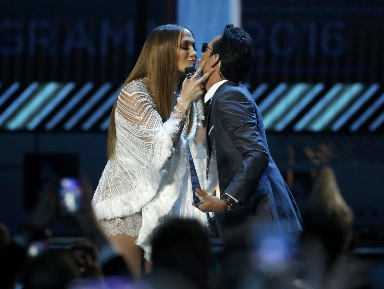 Lopez kisses Anthony after she presented him with an award honoring him as Latin Recording Academy person of the year at the 17th Annual Latin Grammy Awards in Las Vegas