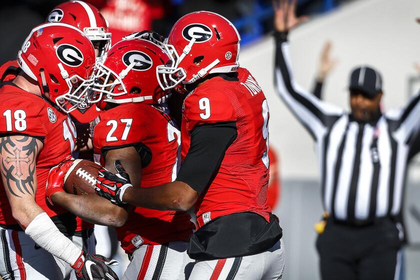 Georgia running back Nick Chubb (27) celebrates with teammates after scoring a touchdown against TCU during the fourth quarter Friday.