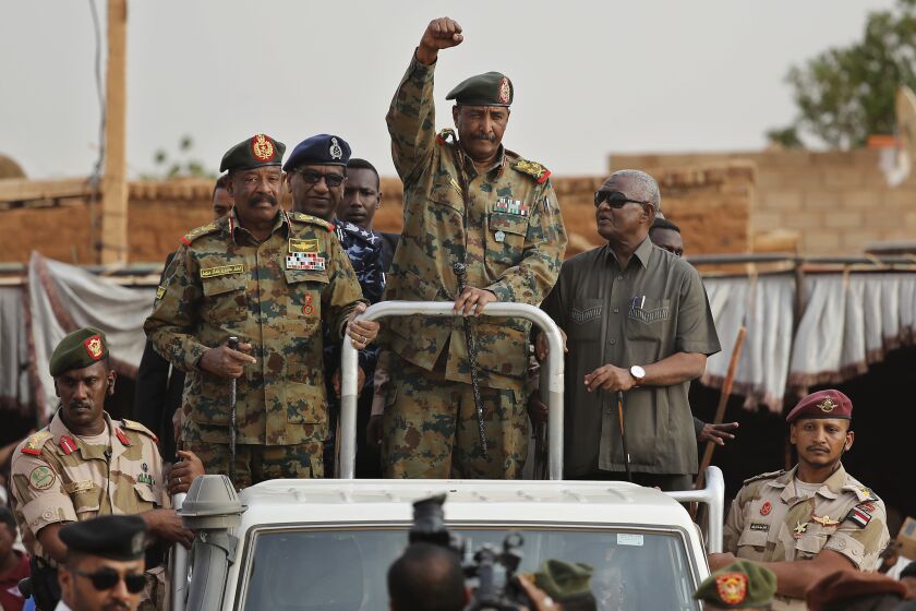 File - Sudanese Gen. Abdel-Fattah Burhan, head of the military council, waves to his supporters upon his arrival to attend a military-backed rally, in Omdurman district, west of Khartoum, Sudan, Saturday, June 29, 2019.(AP Photo/Hussein Malla, File)