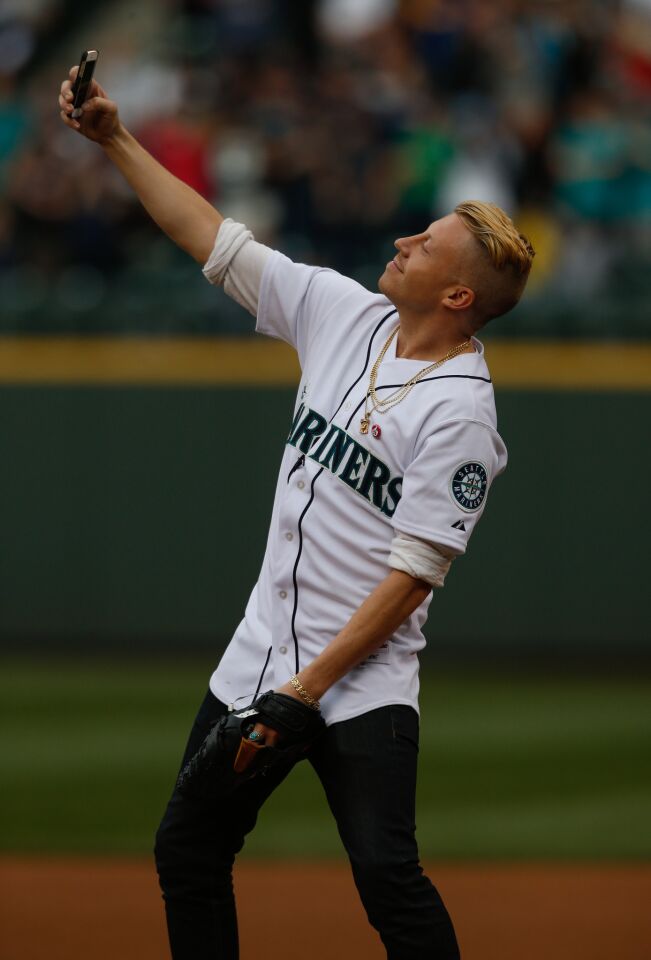 Rap star Macklemore just before throwing out the ceremonial first pitch at the Seattle Mariners-New York Yankees game in Seattle.