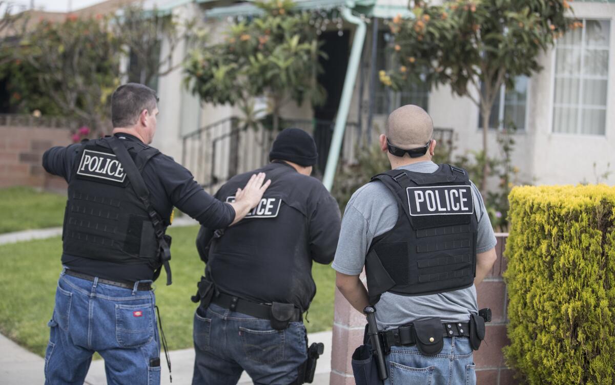 An Immigration and Customs Enforcement fugitive operations team surrounds a Montebello home during an operation in April.