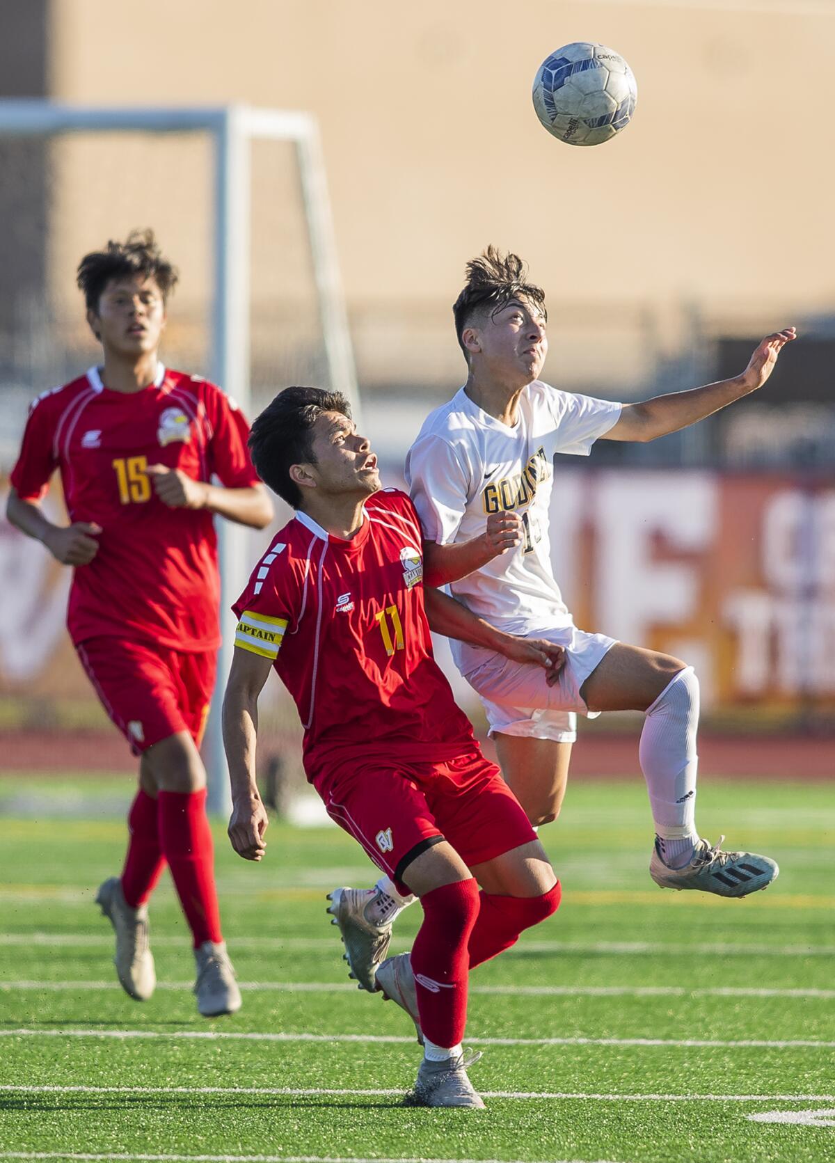 Ocean View's Juan Salazar (11) goes up for a header against Godinez's Andrew Arroyo (15) during a Golden West League match on Wednesday in Huntington Beach.