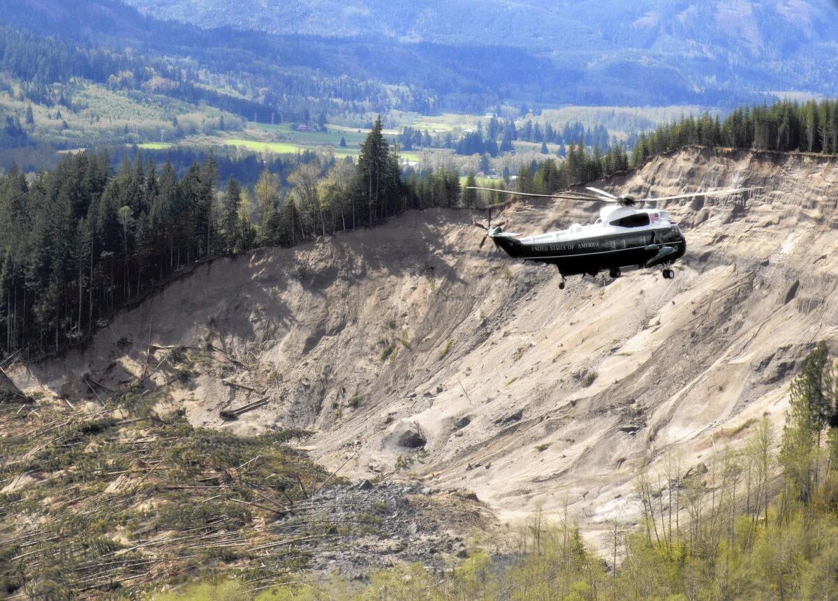 A helicopter carrying President Obama tours the mudslide destruction in Oso, Wash., on Tuesday.