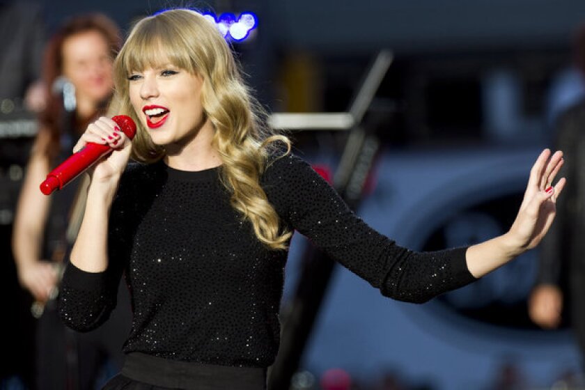 Taylor Swift, performing in Times Square for "Good Morning America," has released the video for her song "Begin Again."
