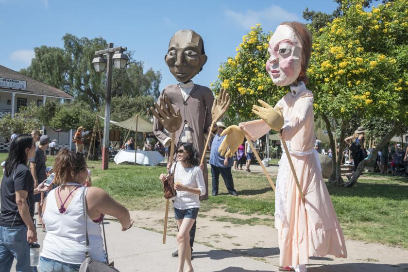 Giant puppets of famous 19th century authors will wander the park during TwainFest.